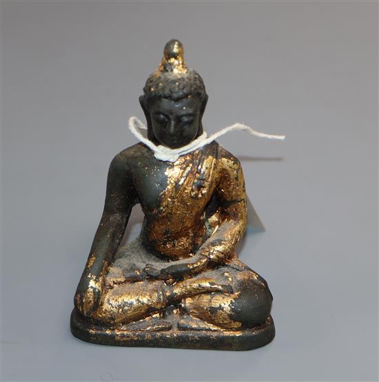 A 17th century Chinese gilded bronze Buddha, H.10.5cm